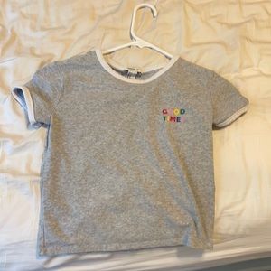 Grey crop top crew neck with the saying “good times” in multicolor, size small